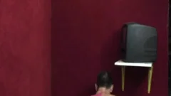An older fellow enjoys sucking penis through A Gloryhole