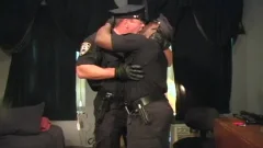 Two muscular Cops poke Each Other