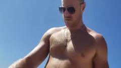darksome And White gay On A Public Beach. Interracial Outdoor