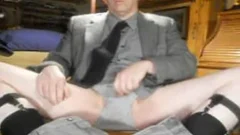 Mature wearing suit having fun with balls daddy
