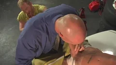 three males nailing In Garage