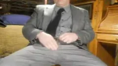 Mature wearing suit having fun with balls daddy