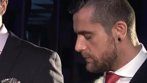 Two males In Suits Meet In A Bar