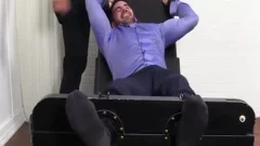 large Muscled Billy Laughs Hard while Tickled On belt Chair