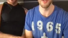 Two fashionable males giving a kiss And Touching Each Other's weenies