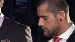 Two males In Suits Meet In A Bar